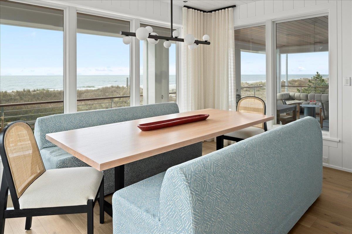 83 25th Street East Avalon, NJ 08202 - Photo 21 of 47 a view of a dining room with furniture large windows and wooden floor