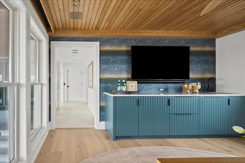 a room with furniture and flat screen tv