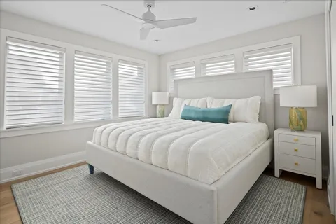 a large white bed in a white room