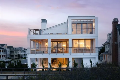 a front view of a building with glass windows and door