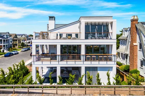 a front view of a building with glass top table and chairs