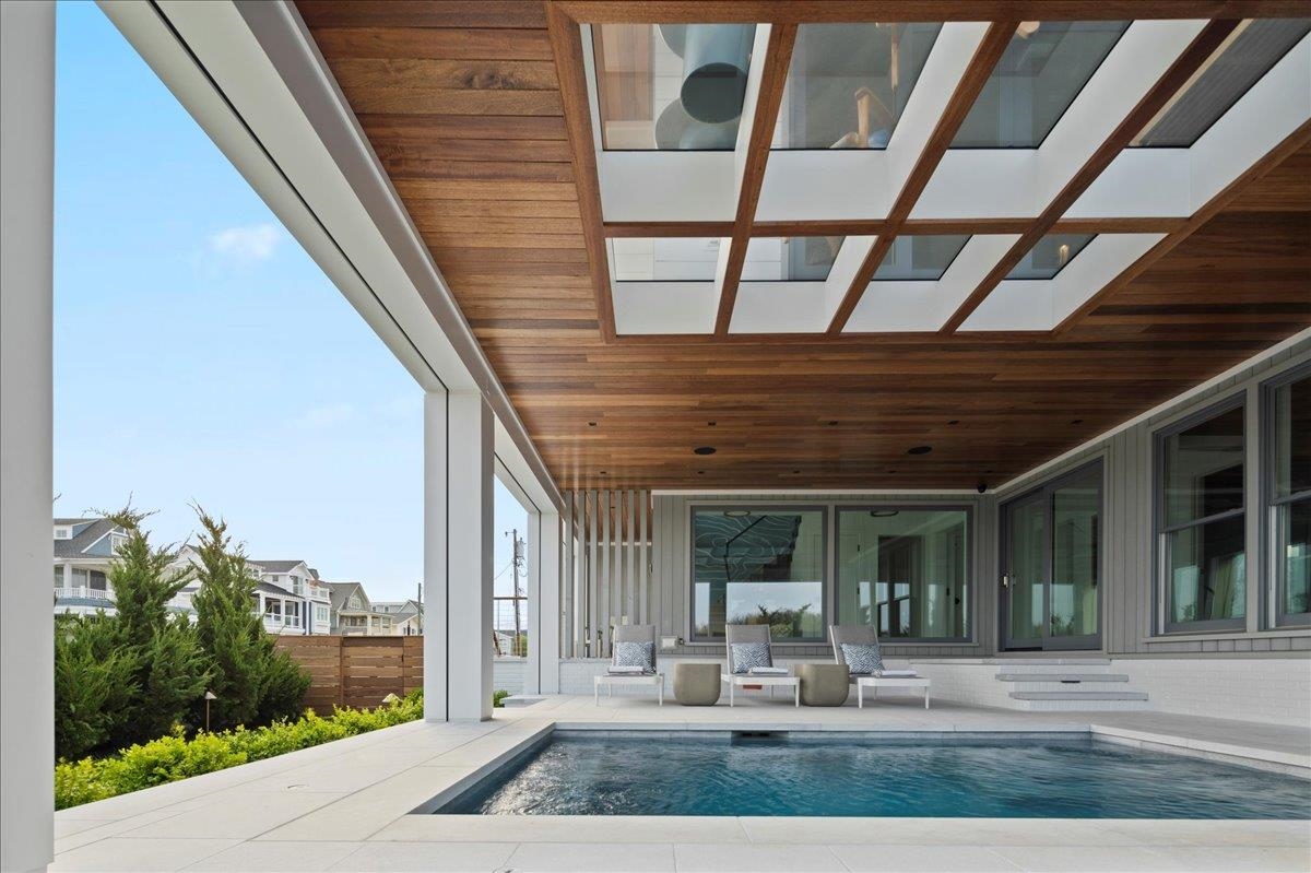 83 25th Street East Avalon, NJ 08202 - Photo 5 of 47 a porch with view of sitting space