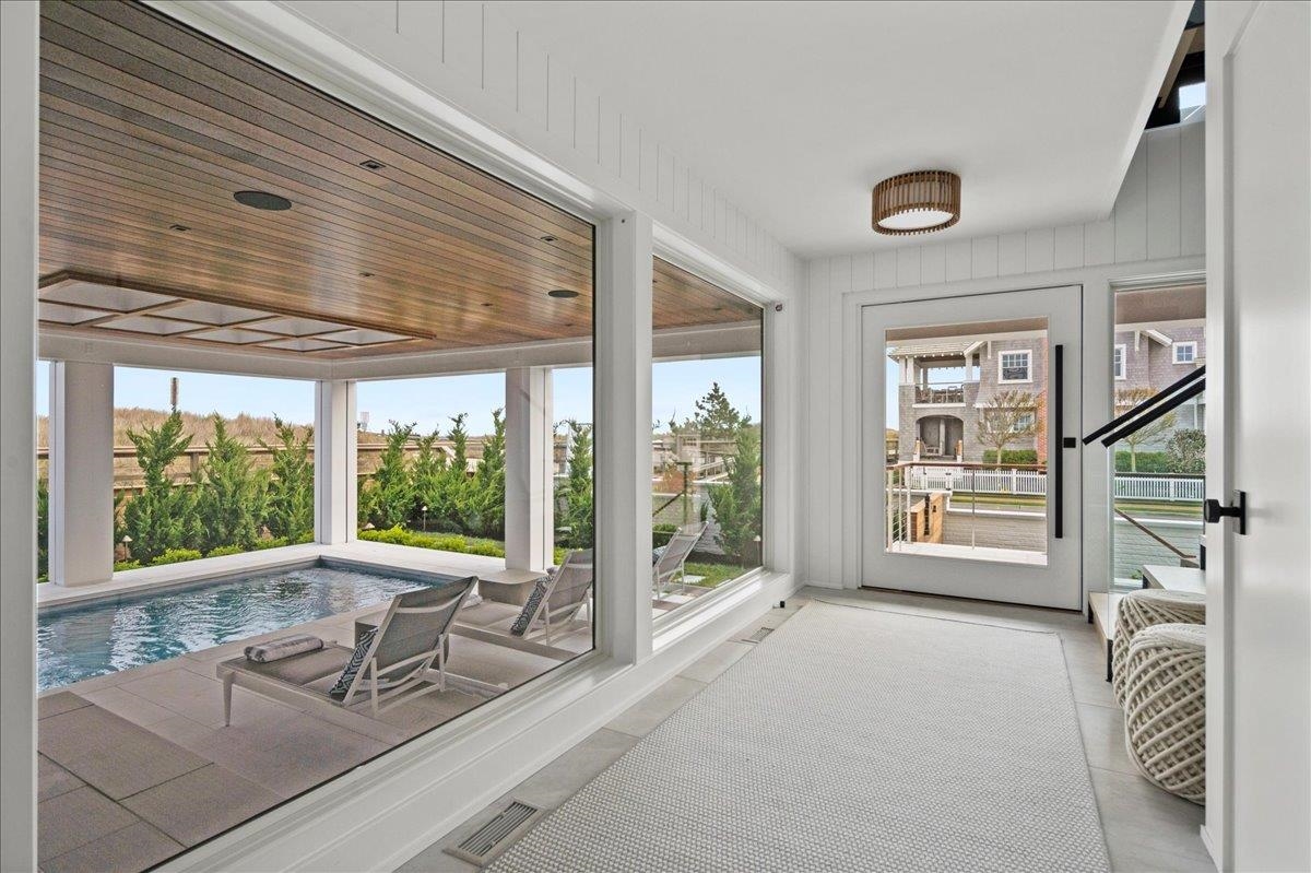 83 25th Street East Avalon, NJ 08202 - Photo 7 of 47 a view of a livingroom with furniture and floor to ceiling window