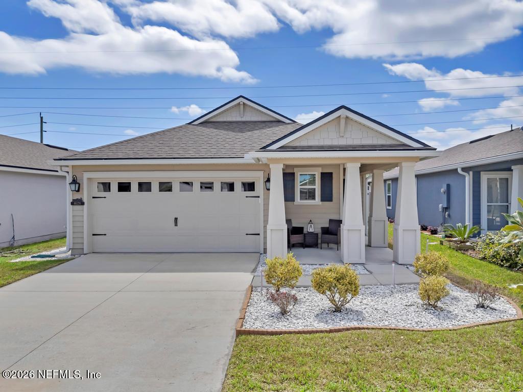 86178 Mainline Road Yulee, FL 32097 - Photo 2 of 61 a view of a house with backyard and sitting area