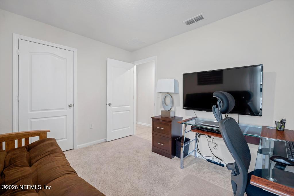 86178 Mainline Road Yulee, FL 32097 - Photo 34 of 61 a livingroom with a workspace