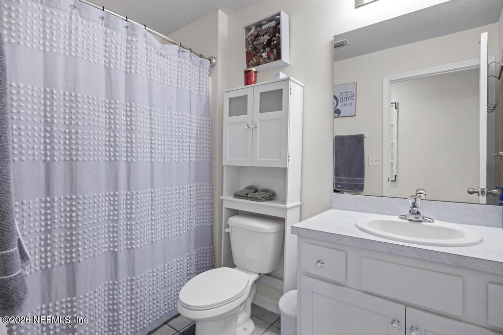 86178 Mainline Road Yulee, FL 32097 - Photo 35 of 61 a bathroom with a sink toilet and shower