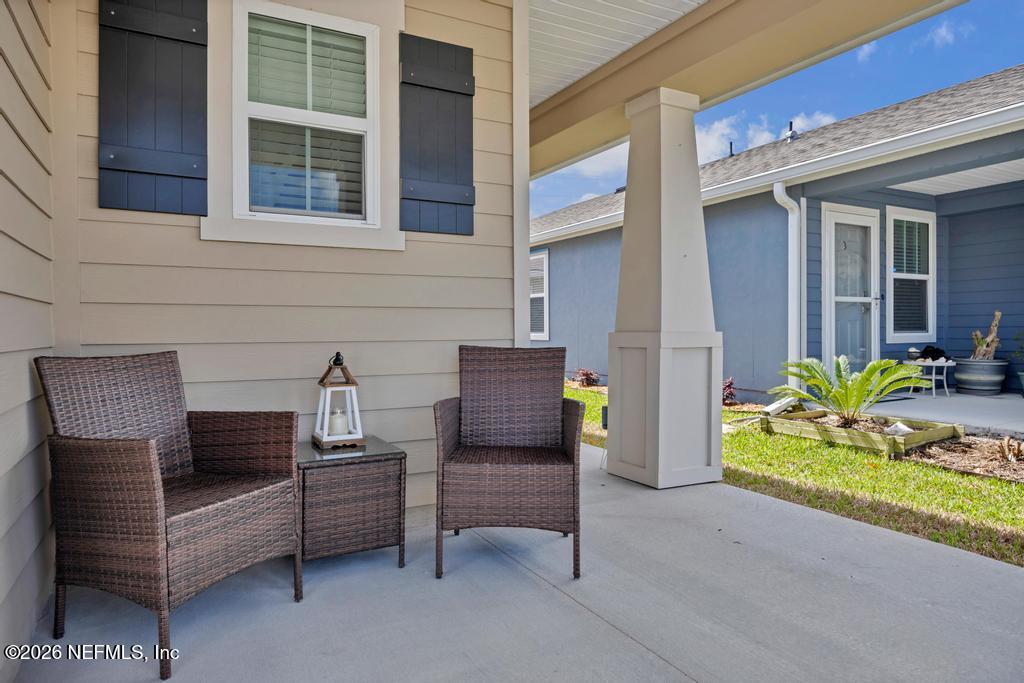 86178 Mainline Road Yulee, FL 32097 - Photo 5 of 61 a view of a two chairs in the balcony