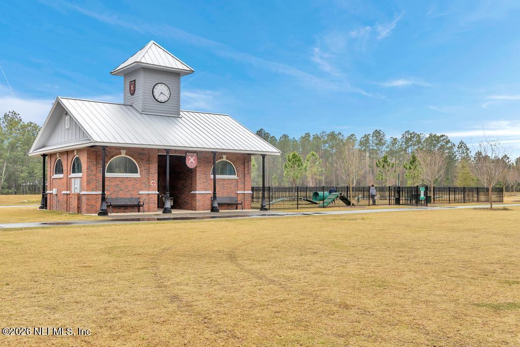 86178 Mainline Road Yulee, FL 32097 - Photo 56 of 61 a front view of a house with swimming pool having outdoor seating