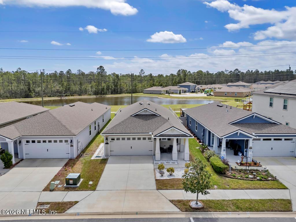 86178 Mainline Road Yulee, FL 32097 - Photo 8 of 61 a aerial view of a house with a lake view