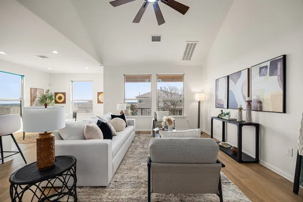 a living room with furniture and a large window