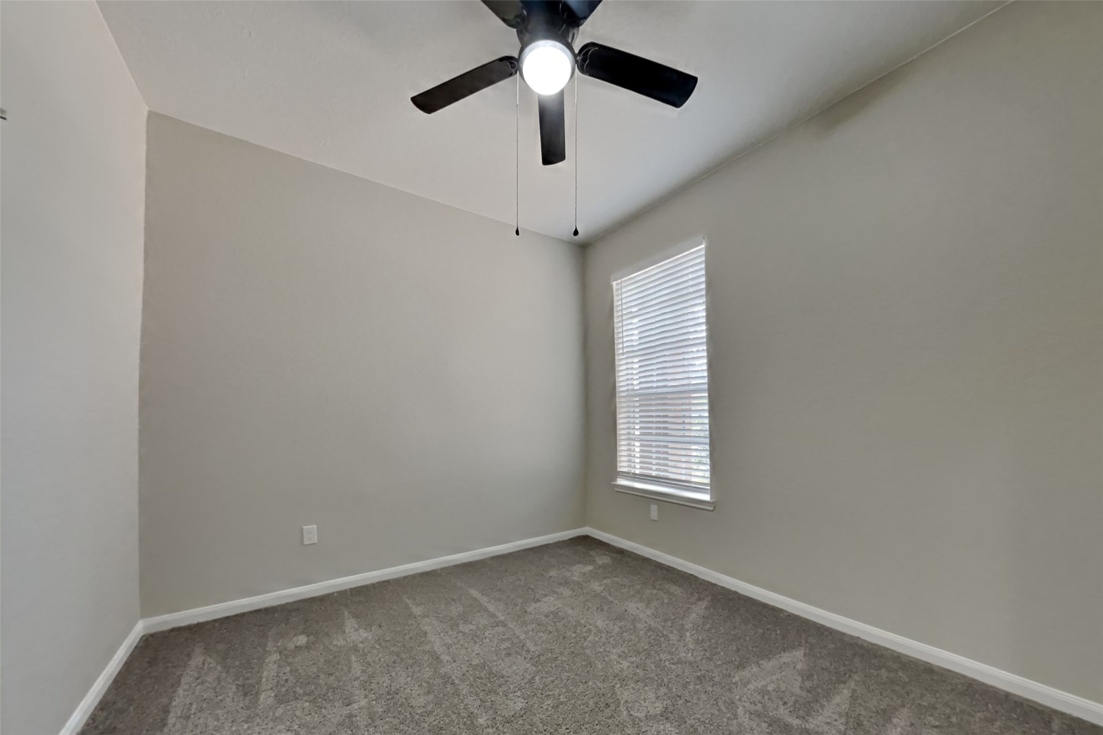 2014 Ridgeway Park Drive Houston, TX 77339 - Photo 15 of 19 an empty room with windows and fan