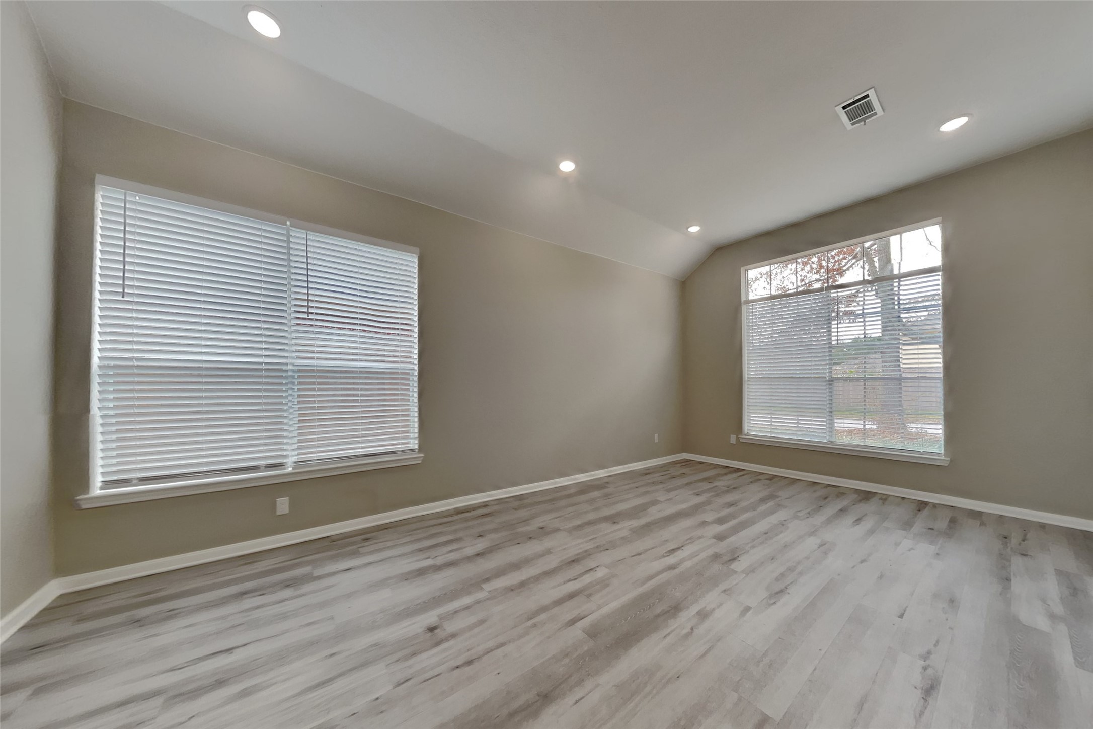 2014 Ridgeway Park Drive Houston, TX 77339 - Photo 8 of 19 a view of an empty room with wooden floor and a window