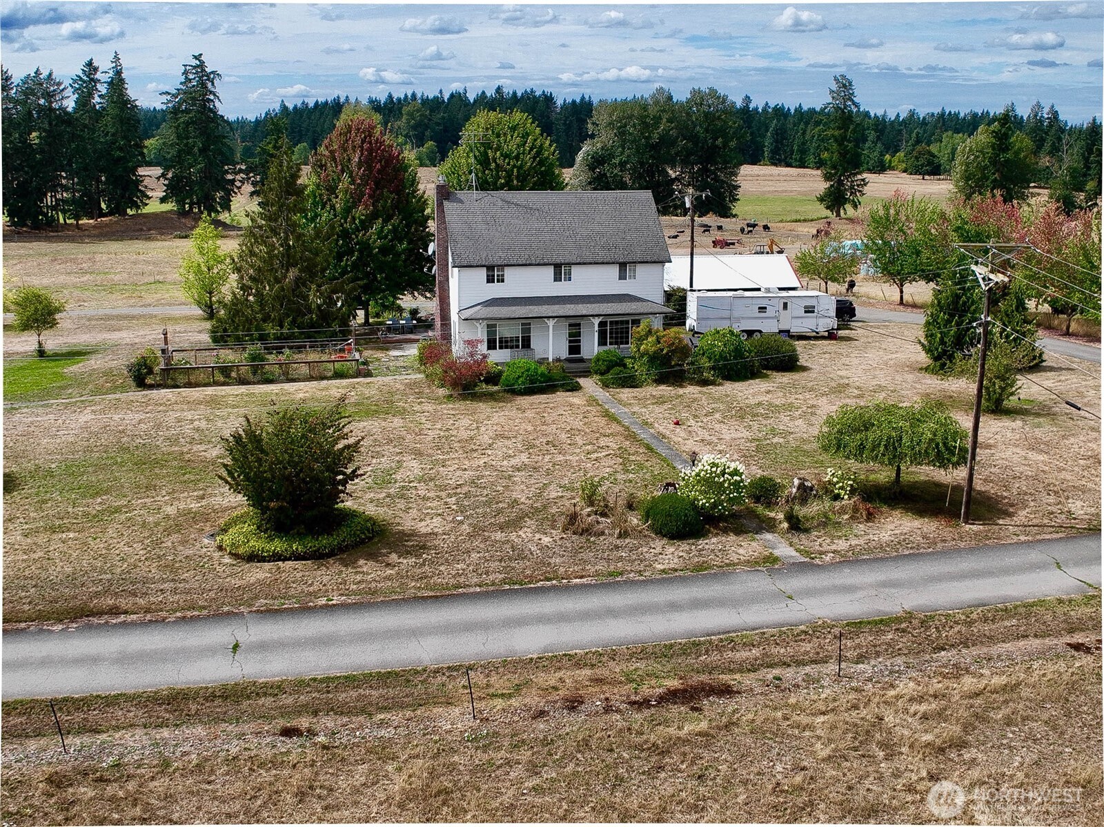 a view of a house with a yard and plants