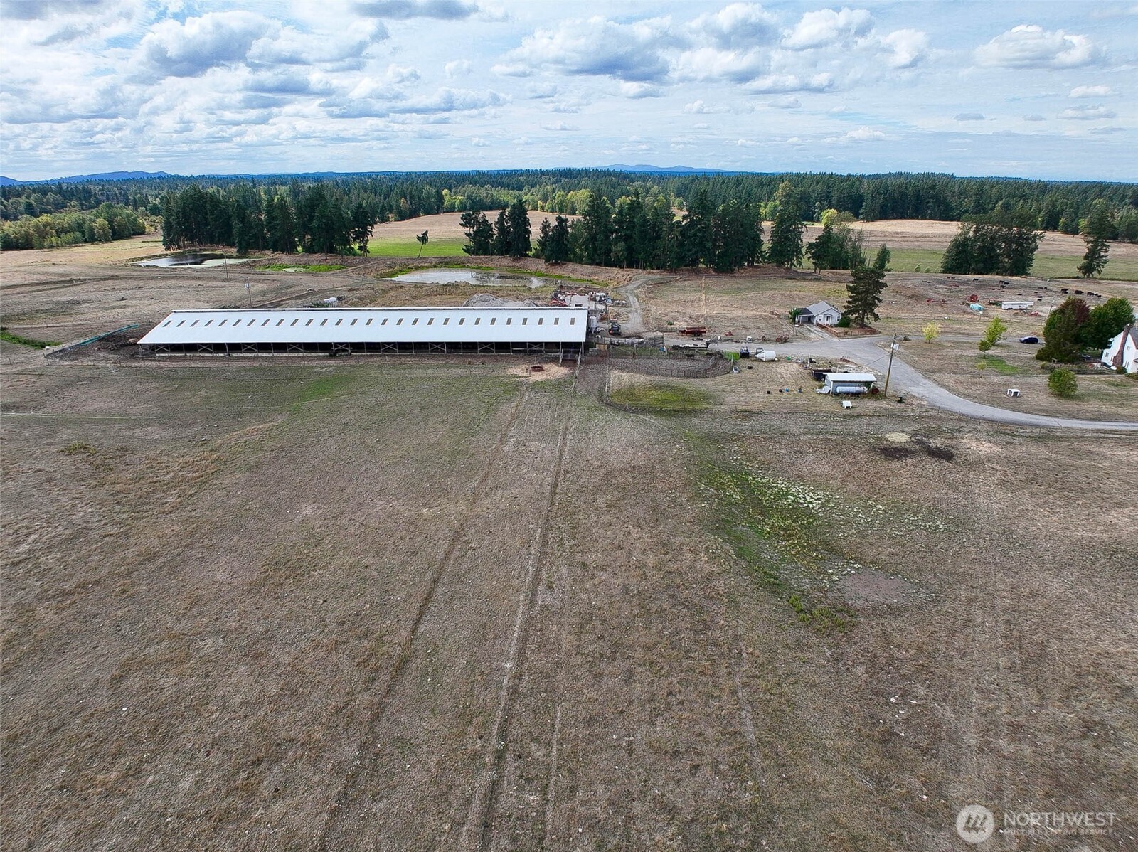 32002 48th Avenue South Roy, WA 98580 - Photo 16 of 40 a view of swimming pool with seating area and lake view