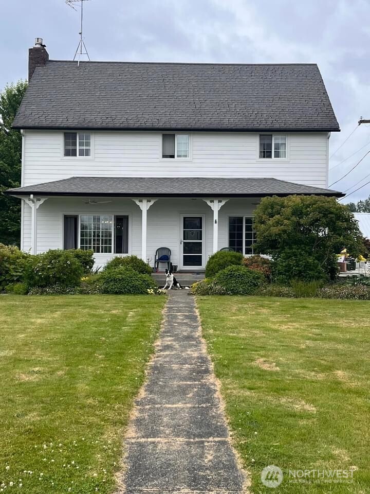 32002 48th Avenue South Roy, WA 98580 - Photo 2 of 40 a front view of a house with a garden
