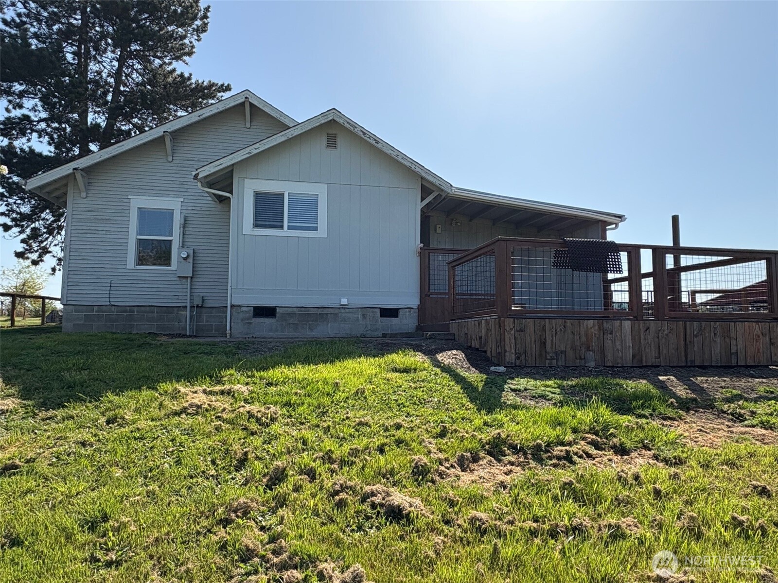 32002 48th Avenue South Roy, WA 98580 - Photo 34 of 40 a view of a backyard with potted plants and wooden fence