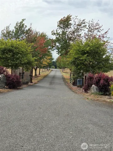 a front view of a house with parking area