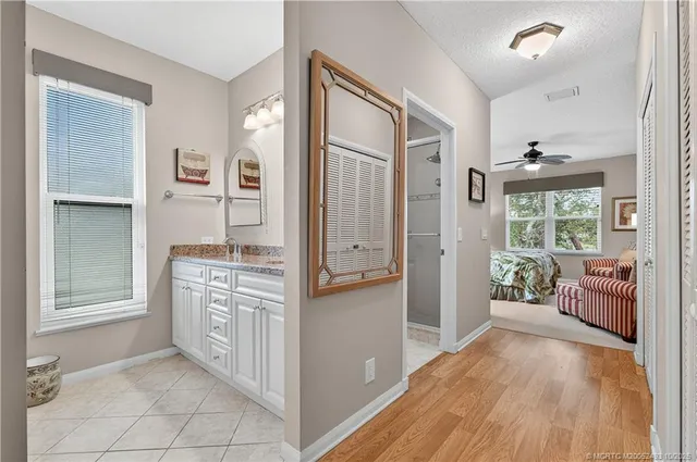 a kitchen with stainless steel appliances granite countertop a refrigerator and a stove