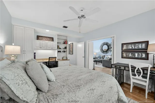 a large bedroom with furniture and a flat screen tv