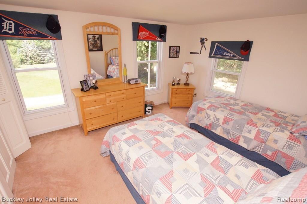 9385 Spencer Road South Lyon, MI 48178 - Photo 14 of 28 2nd Bedroom Upstairs