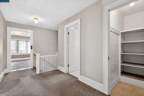 a view of a hallway with closet