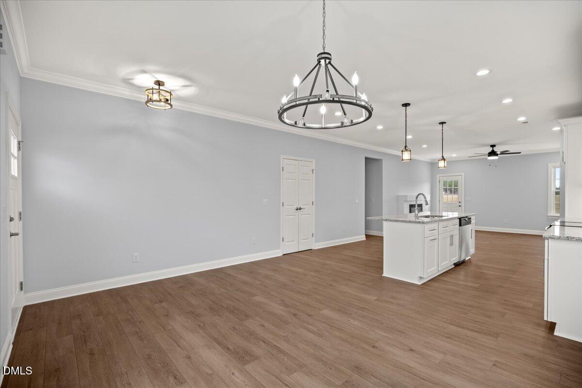 1300 Nick Coley Road Whitakers, NC 27891 - Photo 19 of 47 a view of kitchen with granite countertop cabinets and wooden floor