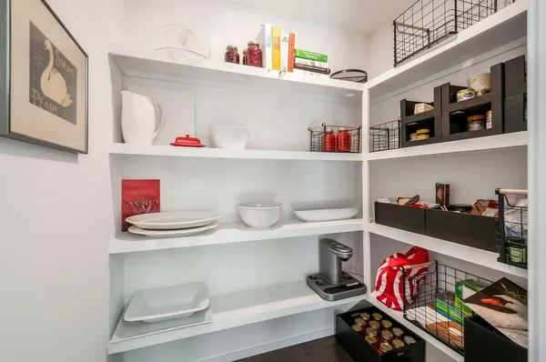a shelf with books and knick knacks on it