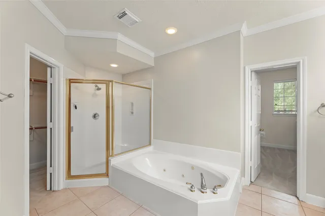a bathroom with a bathtub shower and a sink