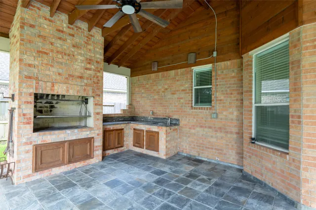 a view of a kitchen with a sink and a stove