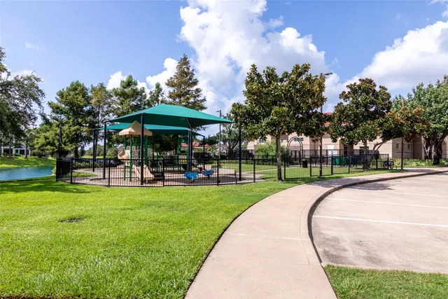 a view of a park with large trees