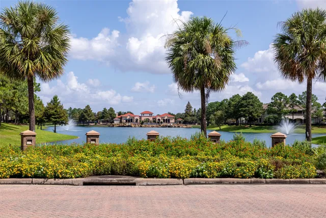 a view of a lake with a garden