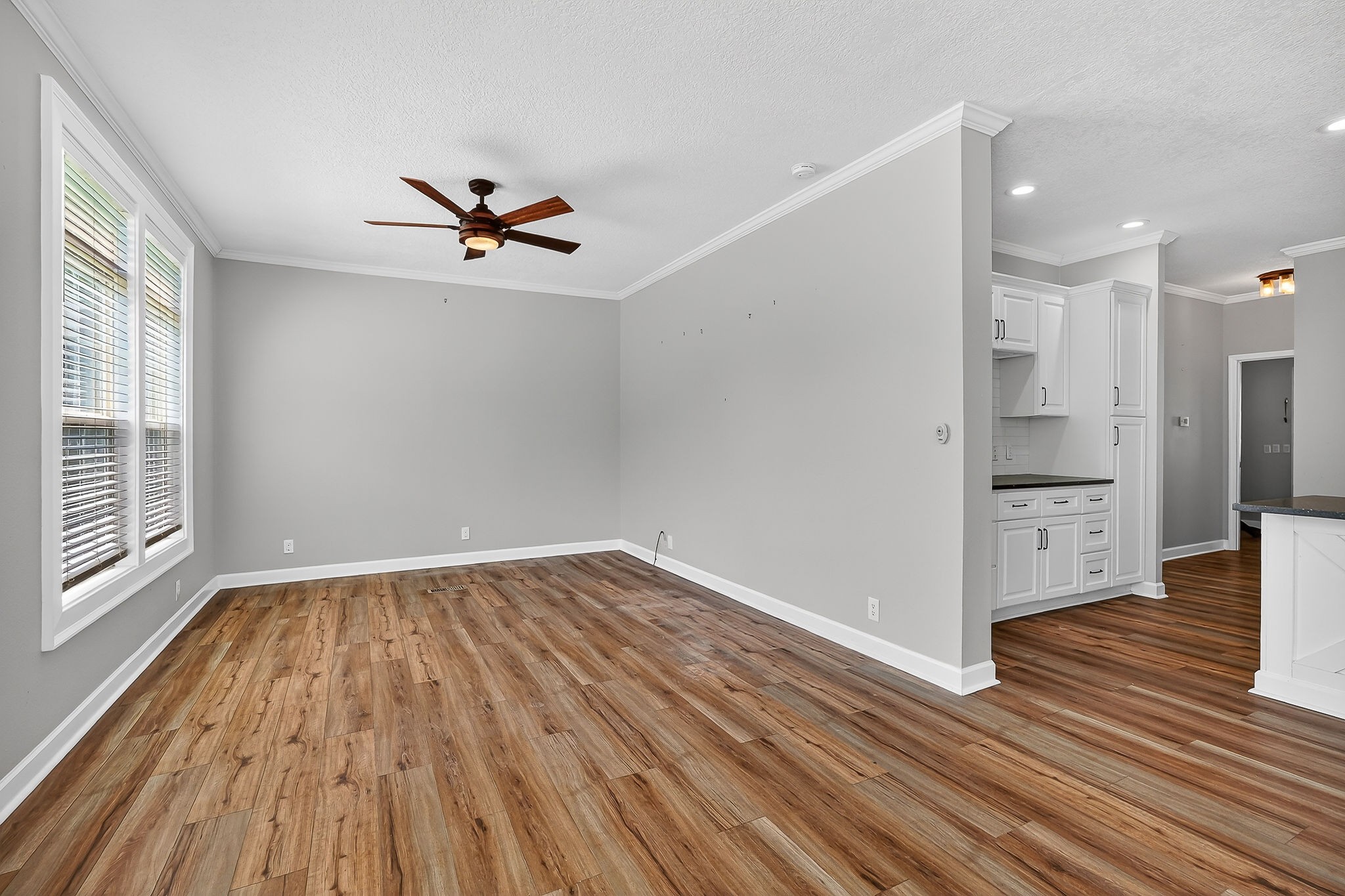 16062 Buffalo Valley Road Silver Point, TN 38582 - Photo 12 of 27 an empty room with wooden floor and windows