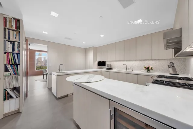 a dining room with furniture and chandelier
