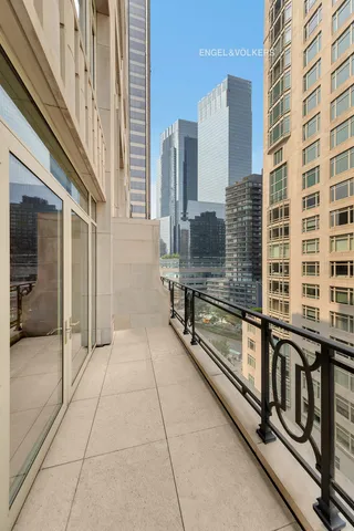 a spacious bedroom with a bed and a couch