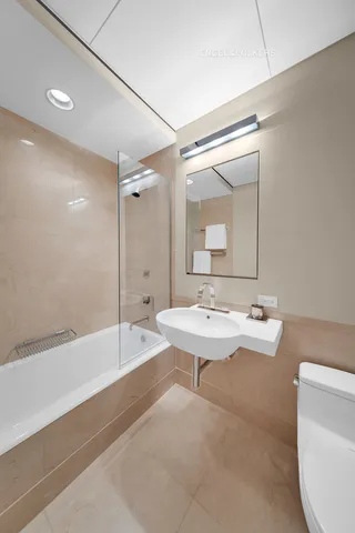 a bathroom with a tub and a sink