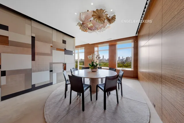 a living room with furniture and a lamp