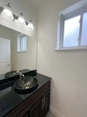 a view of a room with wooden floor and stairs