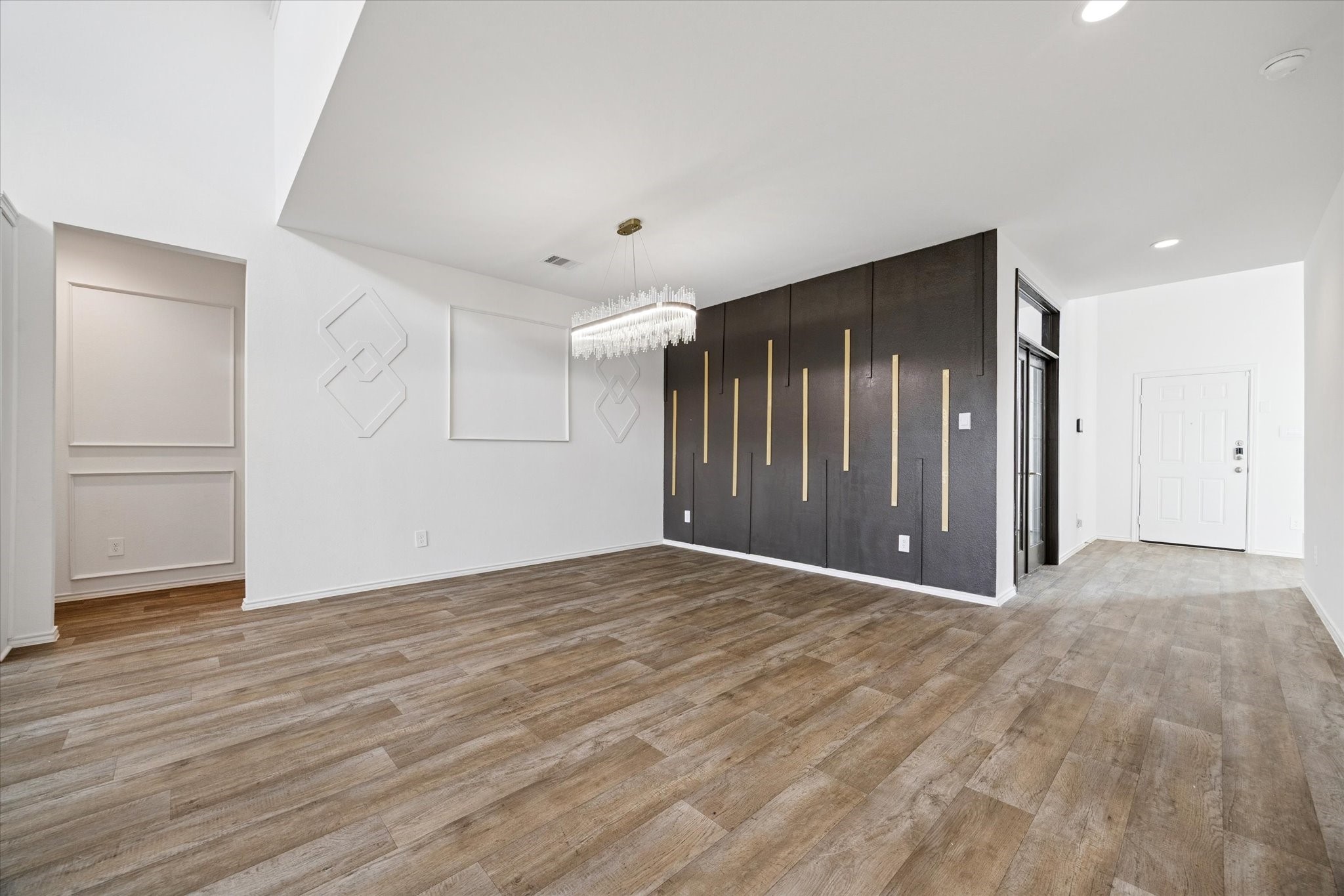 2938 Bur Landing Lane Rosenberg, TX 77469 - Photo 6 of 21 a view of an empty room with wooden floor
