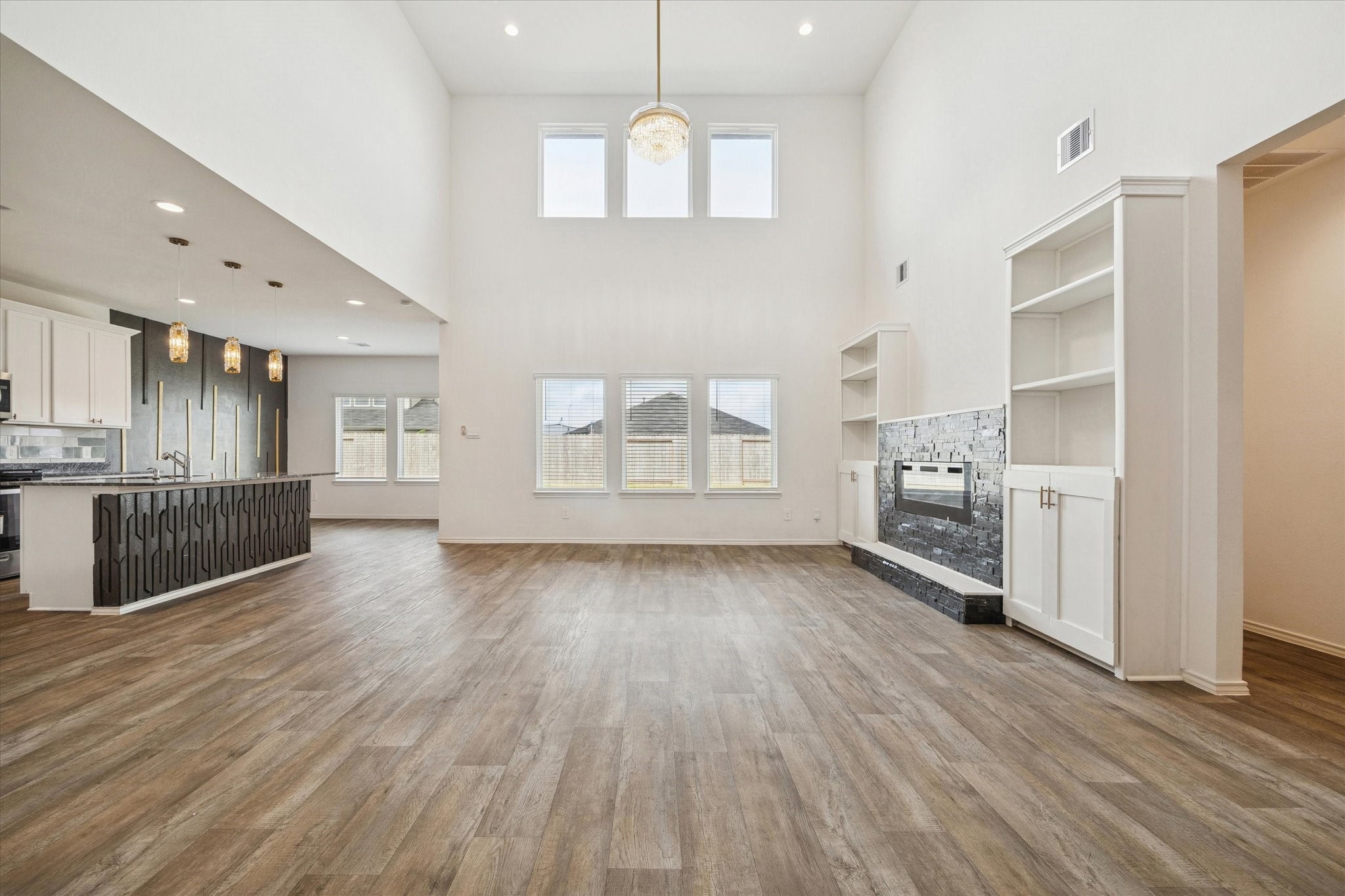 2938 Bur Landing Lane Rosenberg, TX 77469 - Photo 7 of 21 a view of a kitchen with wooden floor and a kitchen