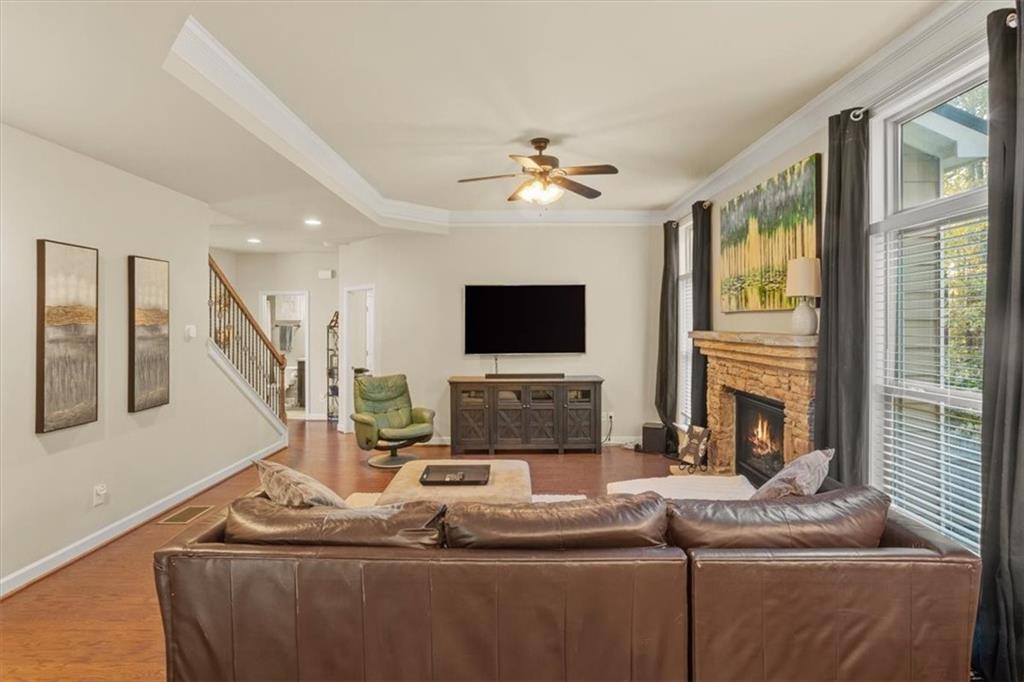 821 Tramore Court Acworth, GA 30102 - Photo 14 of 63 a living room with fireplace furniture and a flat screen tv