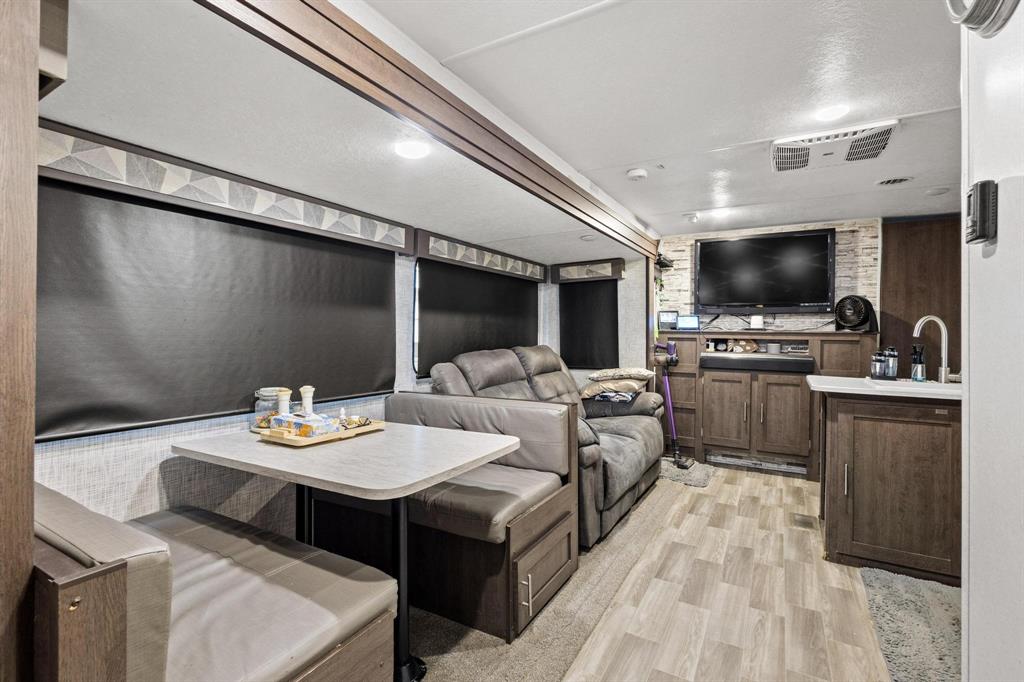 988 County Road Gordonville, TX 76245 - Photo 14 of 35 a living room with furniture and a flat screen tv