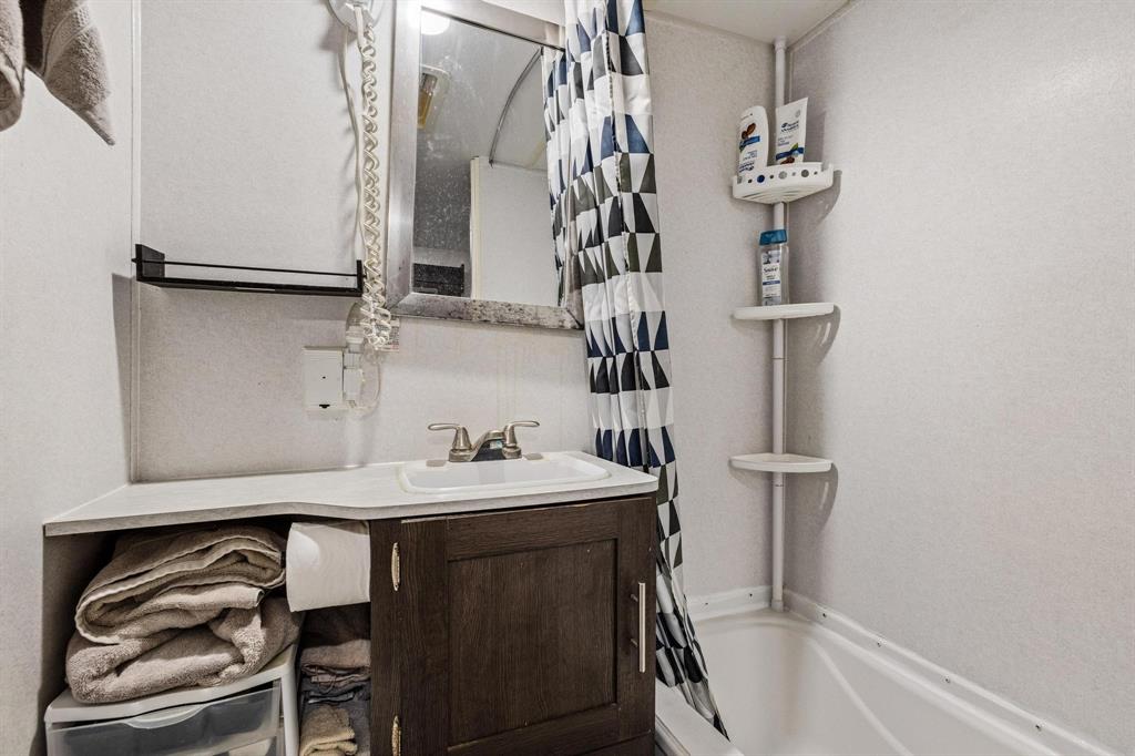 988 County Road Gordonville, TX 76245 - Photo 17 of 35 a bathroom with a sink and a mirror