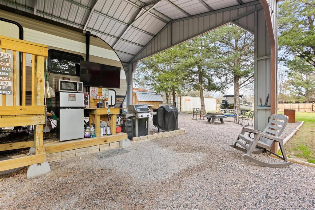 988 County Road Gordonville, TX 76245 - Photo 19 of 35 a view of a chairs and table in the patio