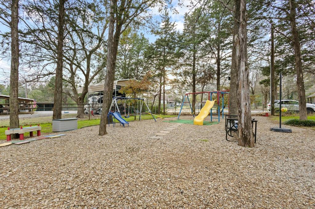 988 County Road Gordonville, TX 76245 - Photo 2 of 35 a view of a park with swings and slides