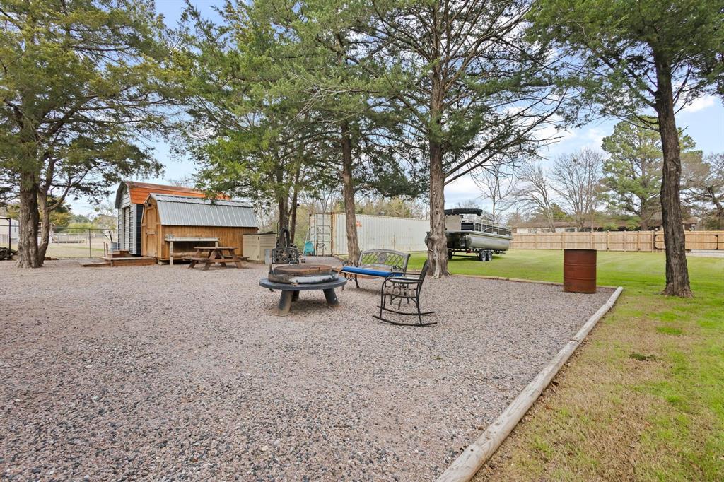 988 County Road Gordonville, TX 76245 - Photo 21 of 35 a view of a park with bench and a tree