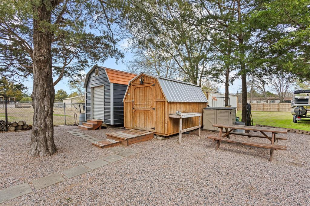 988 County Road Gordonville, TX 76245 - Photo 6 of 35 a view of a house with backyard and sitting area