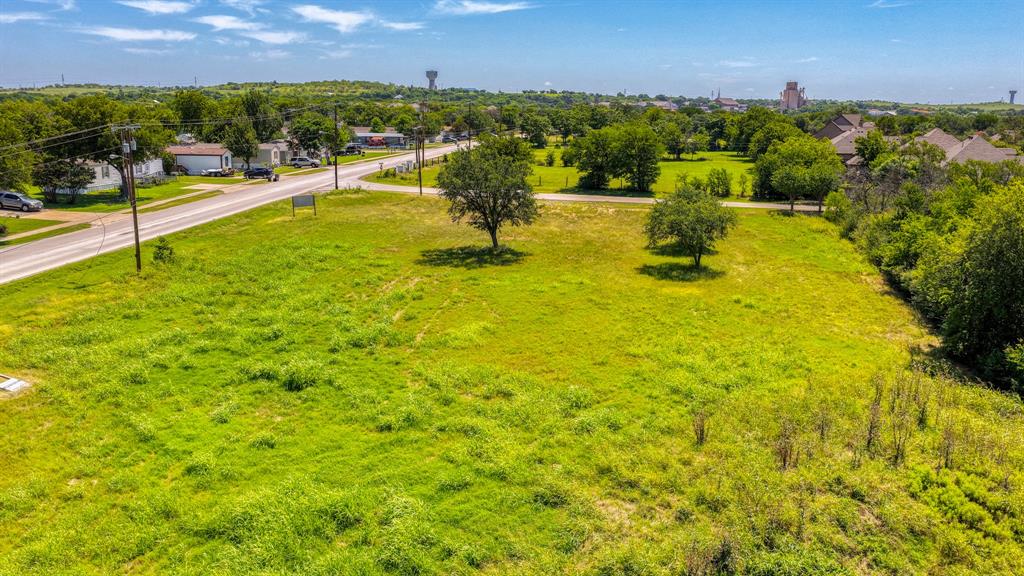 619 Old Annetta Road Aledo, TX 76008 - Photo 8 of 16 Expansive green lot featuring mature trees and a paved road frontage