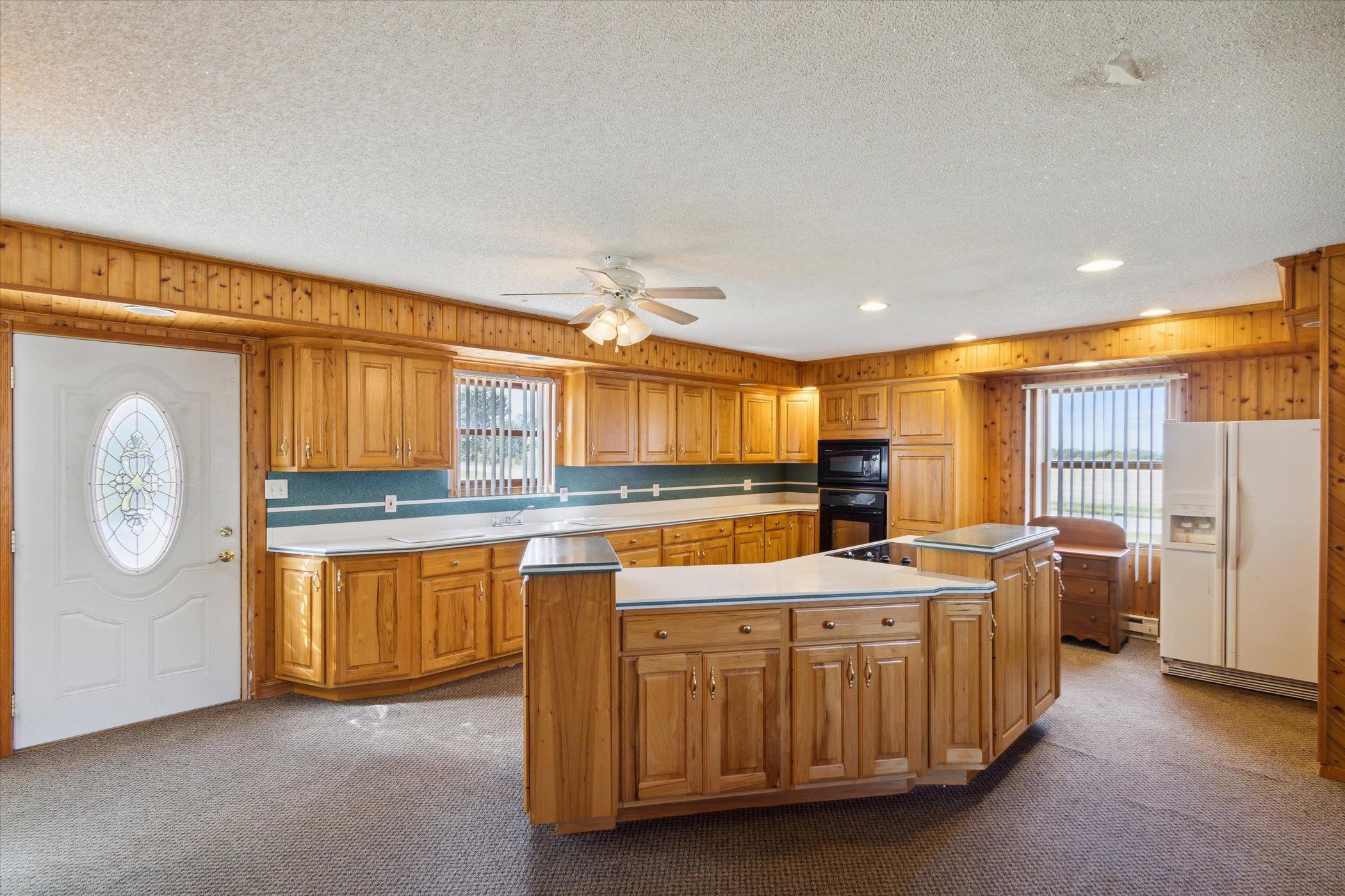 4994 North Unity Road Lena, IL 61048 - Photo 11 of 50 a kitchen with stainless steel appliances granite countertop a sink stove and cabinets