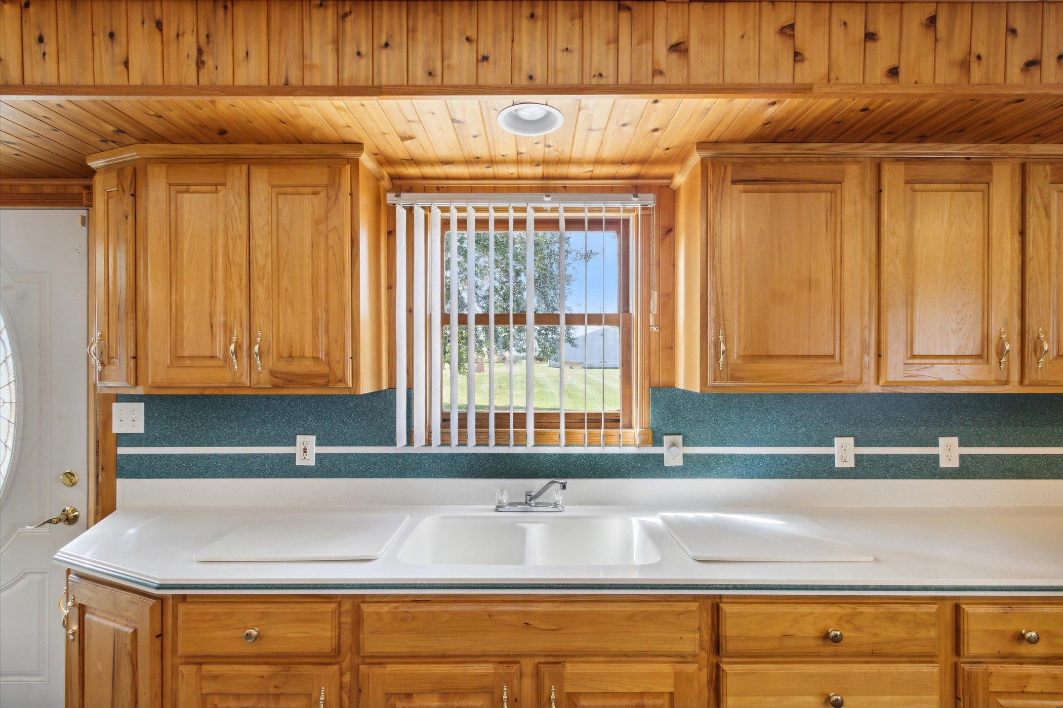 4994 North Unity Road Lena, IL 61048 - Photo 12 of 50 a kitchen with granite countertop a sink and a window