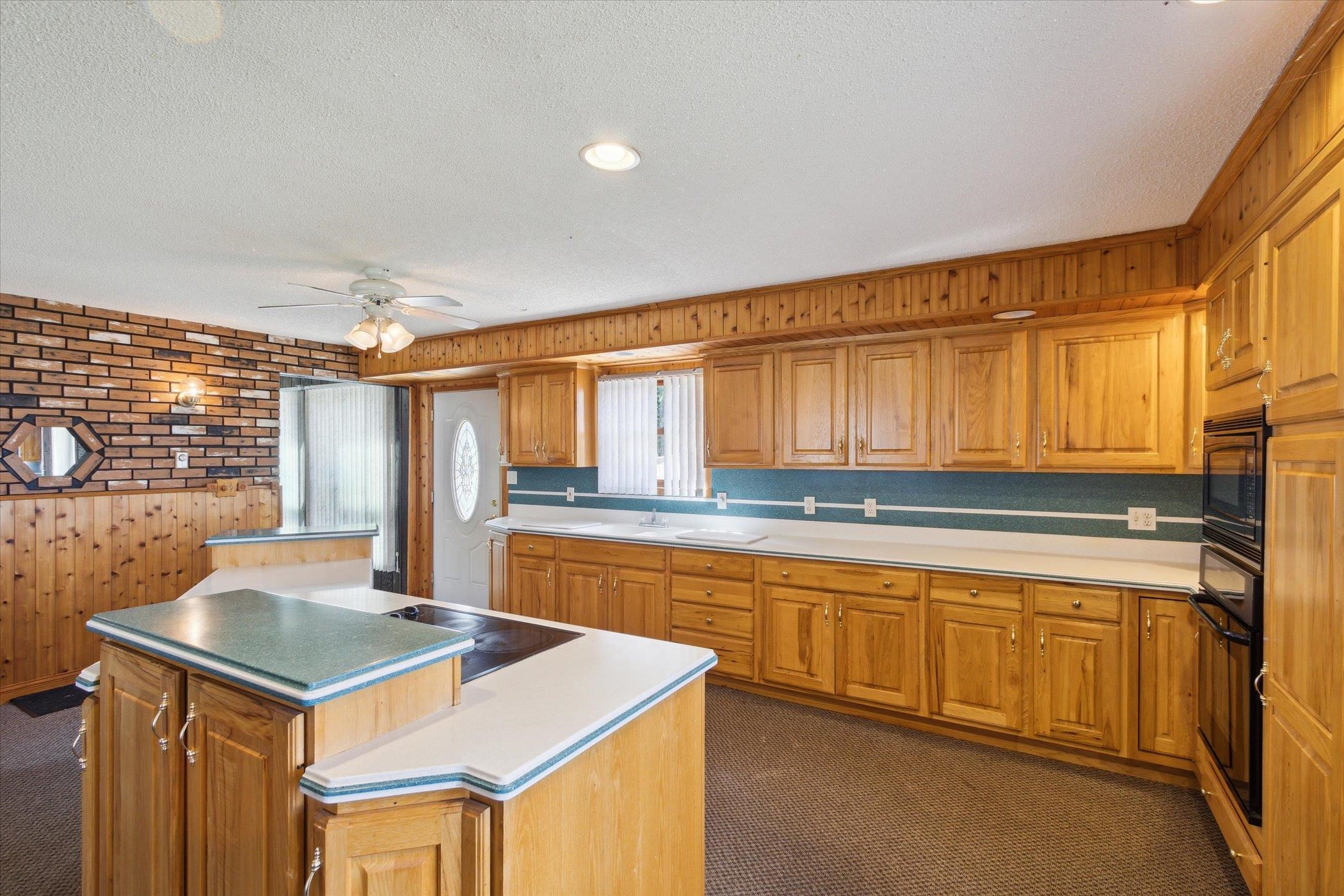 4994 North Unity Road Lena, IL 61048 - Photo 13 of 50 a kitchen that has a sink and a stove in it